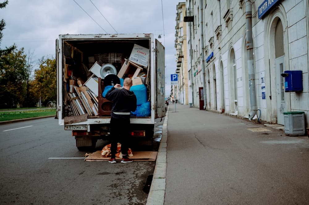 Professional mover unloading furniture from a moving truck